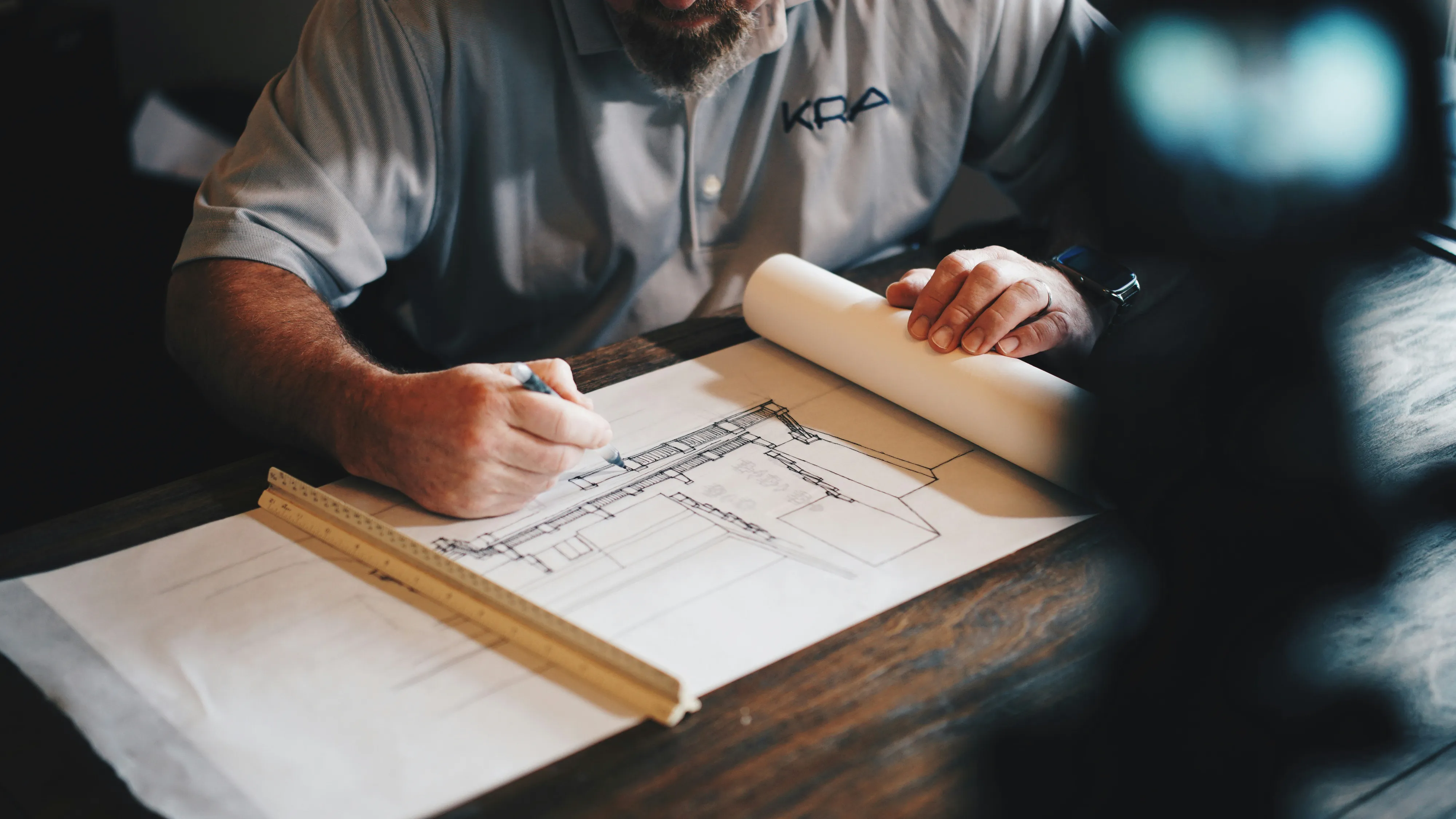 Commercial property claim documents and building plans arranged for technical review.